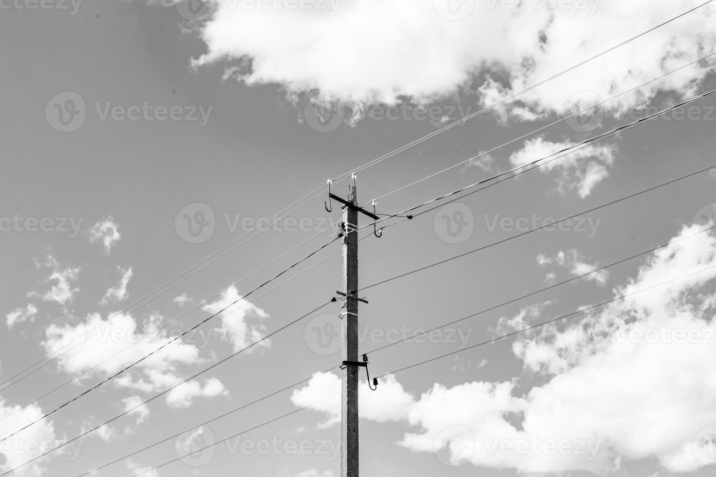 Power electric pole with line wire on light background close up photo