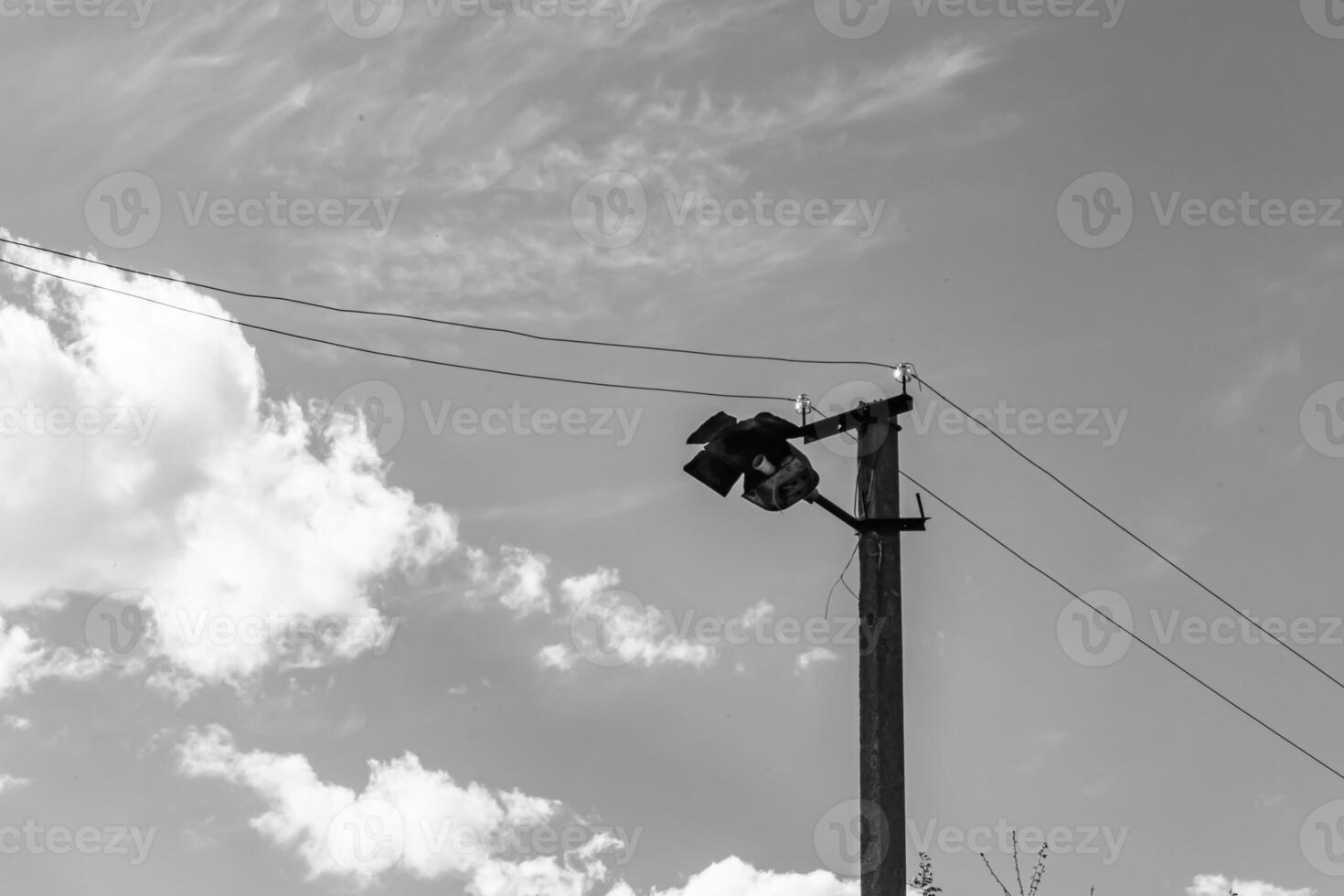 Power electric pole with line wire on light background close up photo