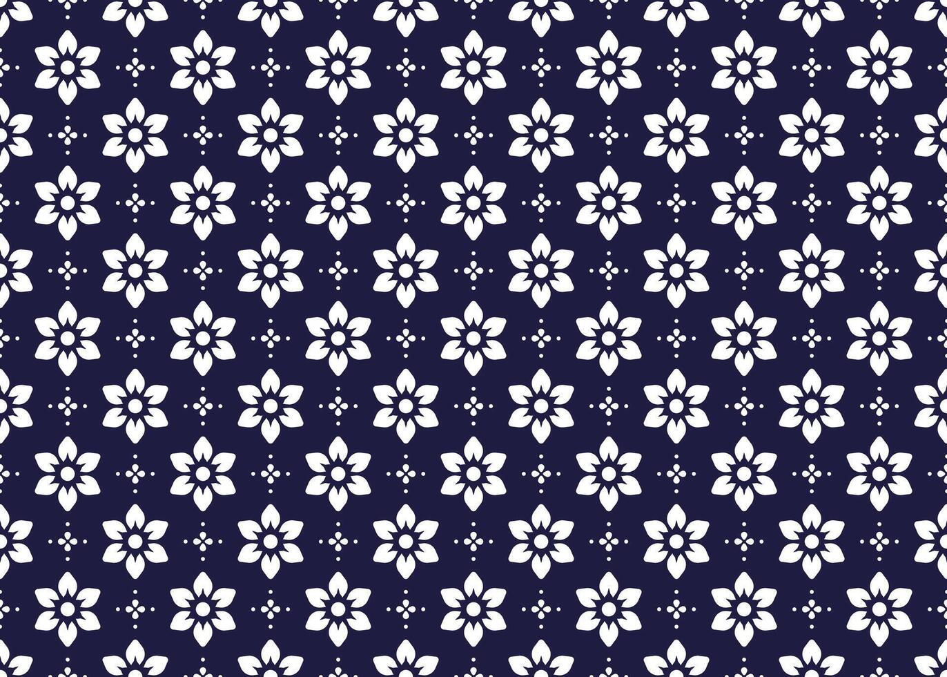 White symbol flowers on dark blue background, ethnic fabric seamless pattern design for cloth, carpet, batik, wallpaper, wrapping etc. vector