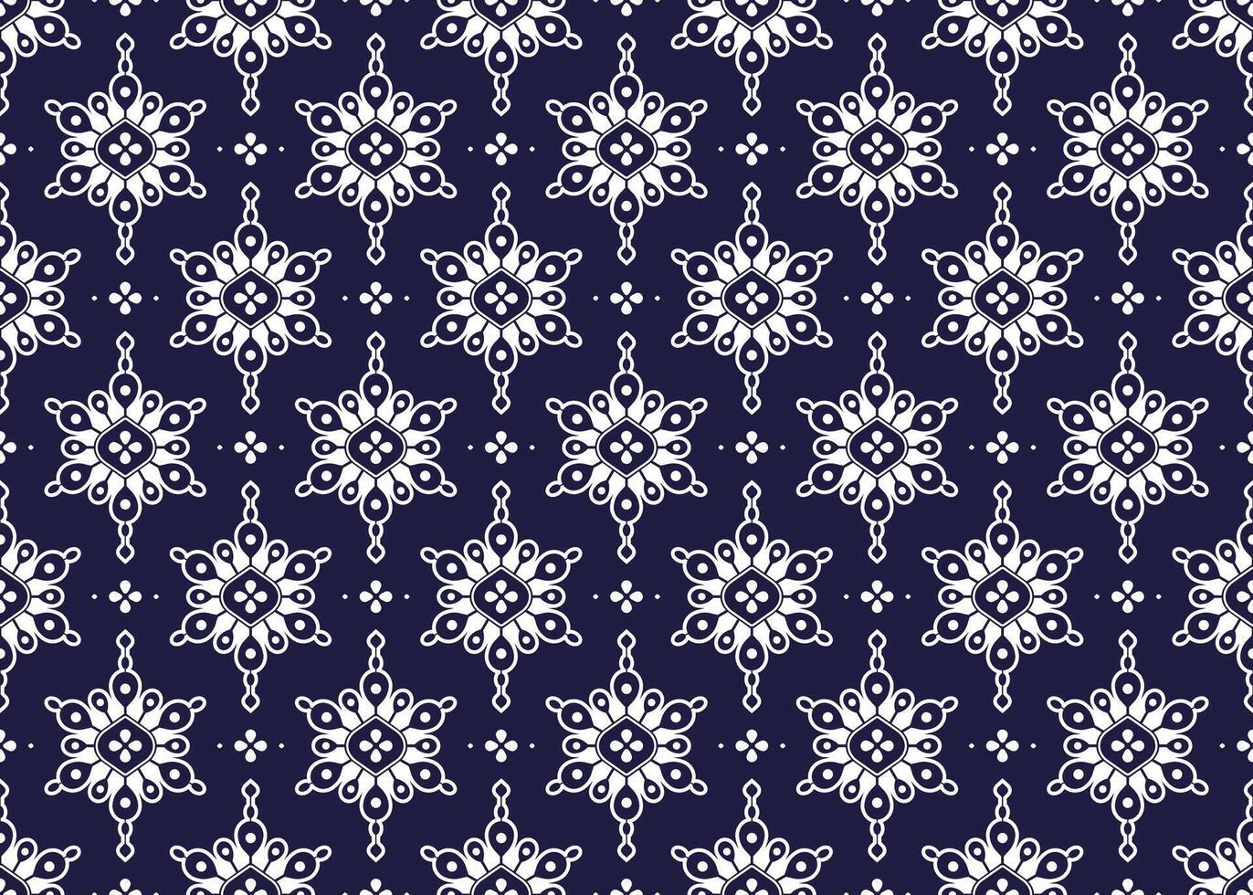 White geometric and symbol flowers design on dark blue background, ethnic fabric seamless pattern design for cloth, carpet, batik, wallpaper, wrapping etc. vector