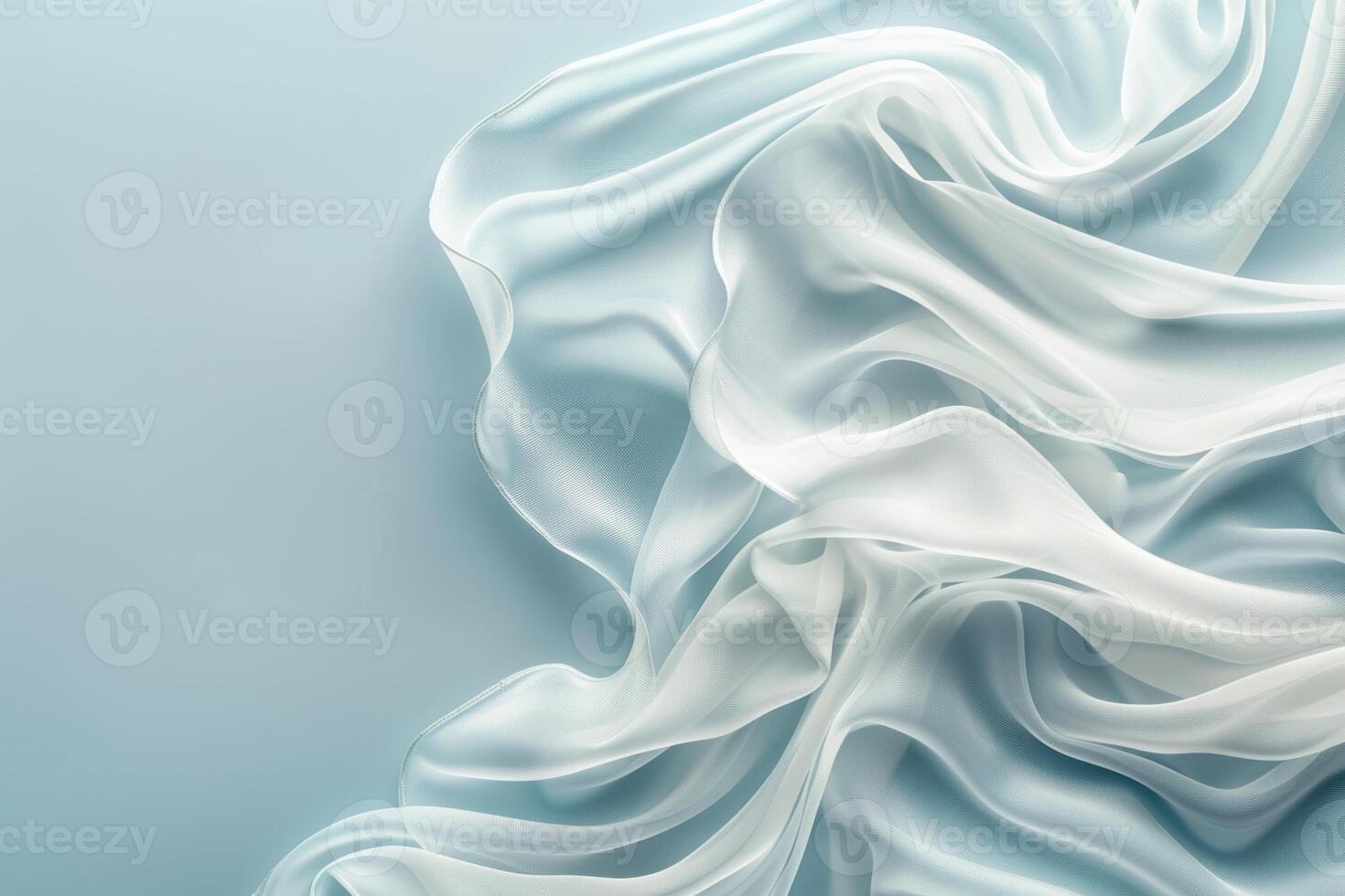 Tranquil blue silk waves flowing fabric abstract background with ample space for text photo