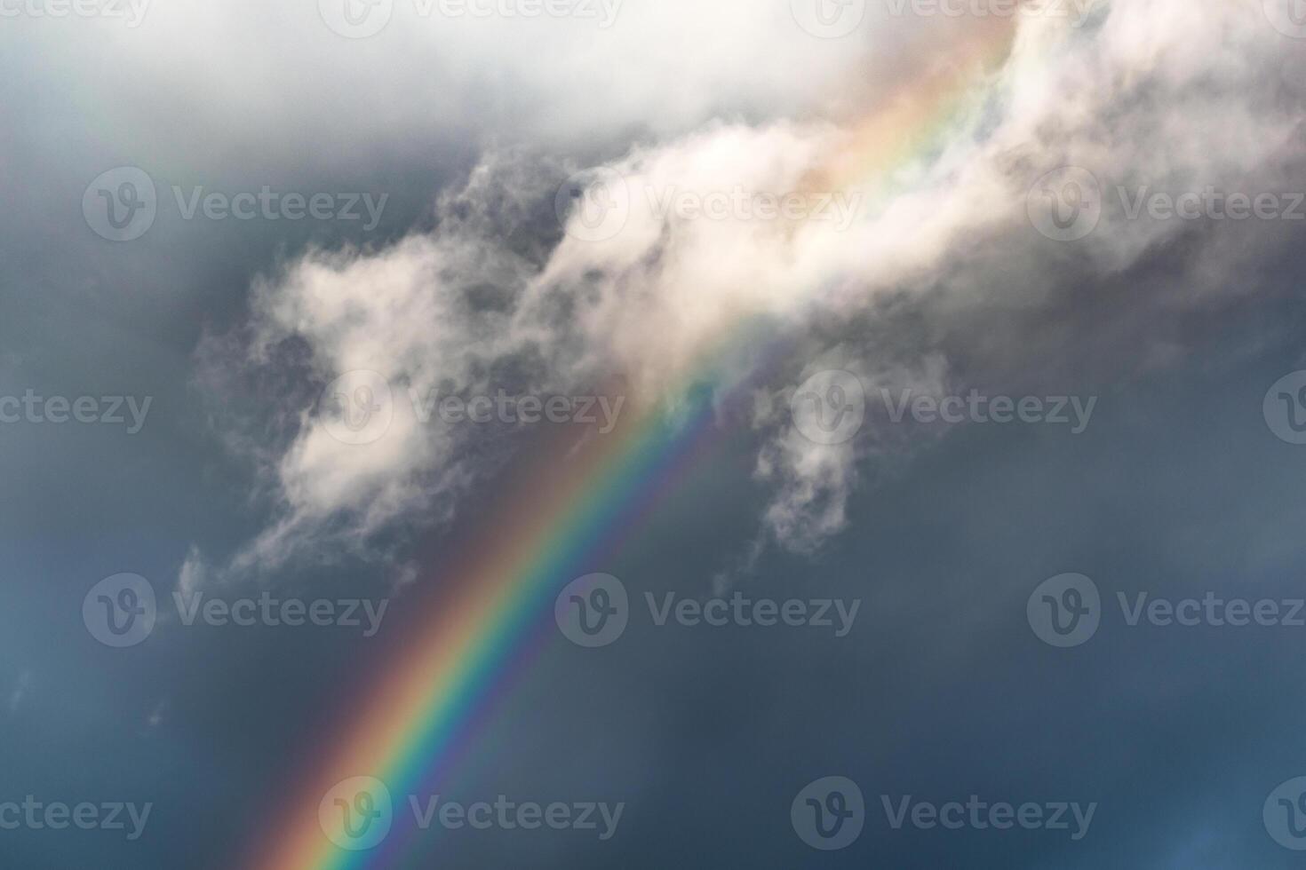 Rainbow on a spring day thanks to the rain and the sun photo