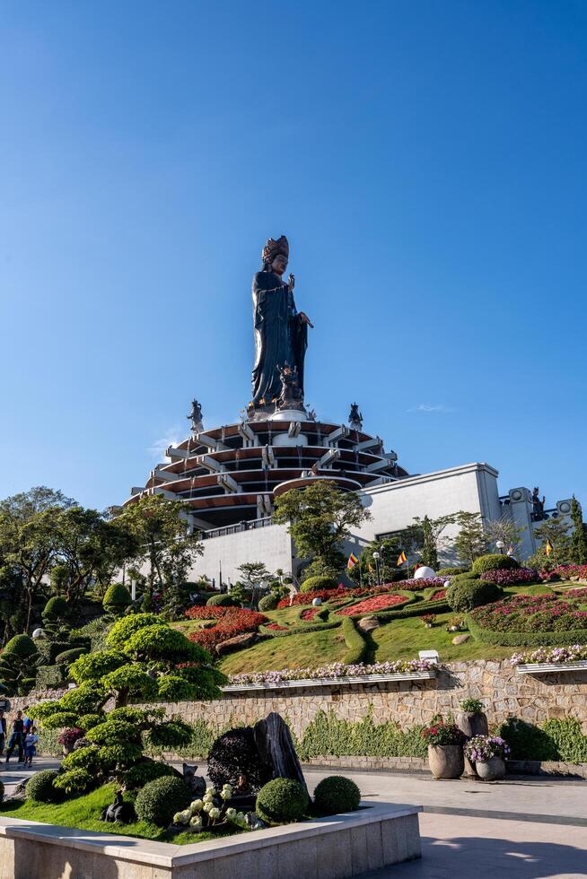View of Ba Den mountain tourist area, Tay Ninh province, Vietnam. A unique Buddhist architecture with the highest elevation in the area view from below is very beautiful. photo