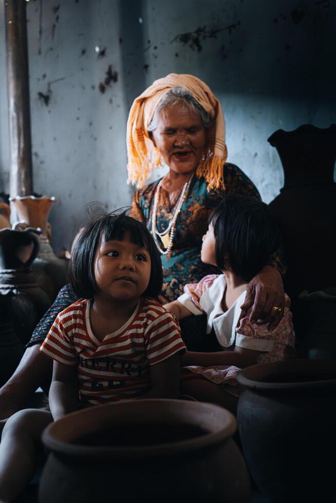old female of Cham ethnic girl in Bau Truc pottery village, Phan Rang city, Ninh Thuan province, Vietnam. People and travel concept. photo