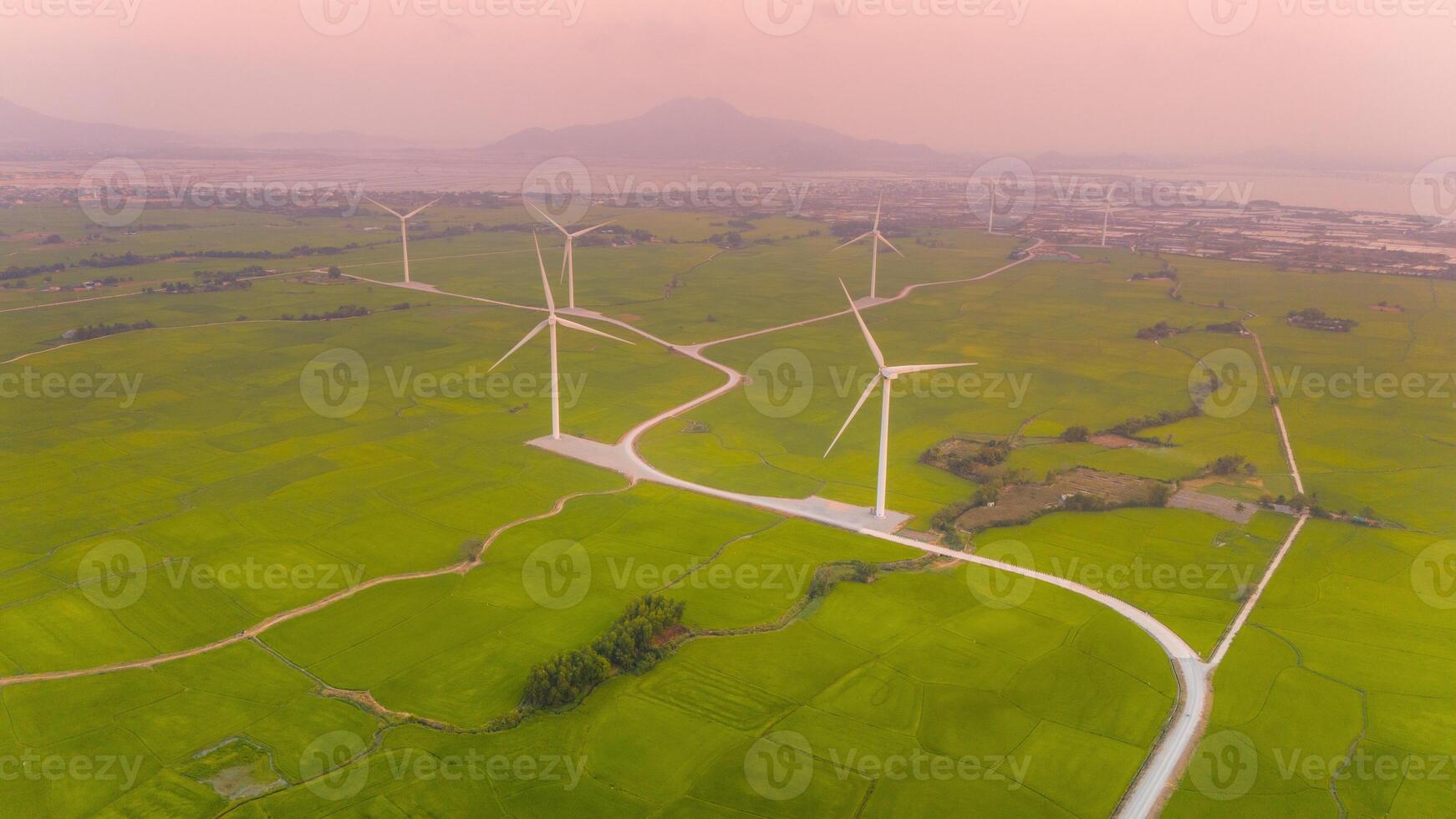 view of turbine green energy electricity, windmill for electric power production, Wind turbines generating electricity on rice field at Phan Rang, Ninh Thuan province, Vietnam photo