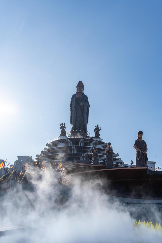 View of Ba Den mountain tourist area, Tay Ninh province, Vietnam. A unique Buddhist architecture with the highest elevation in the area view from below is very beautiful. photo