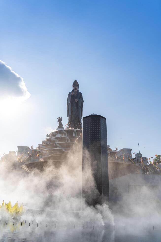 View of Ba Den mountain tourist area, Tay Ninh province, Vietnam. A unique Buddhist architecture with the highest elevation in the area view from below is very beautiful. photo