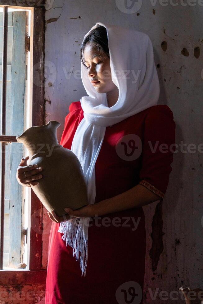 portrait of Cham ethnic girl in Bau Truc pottery village, Phan Rang city, Ninh Thuan province, Vietnam photo