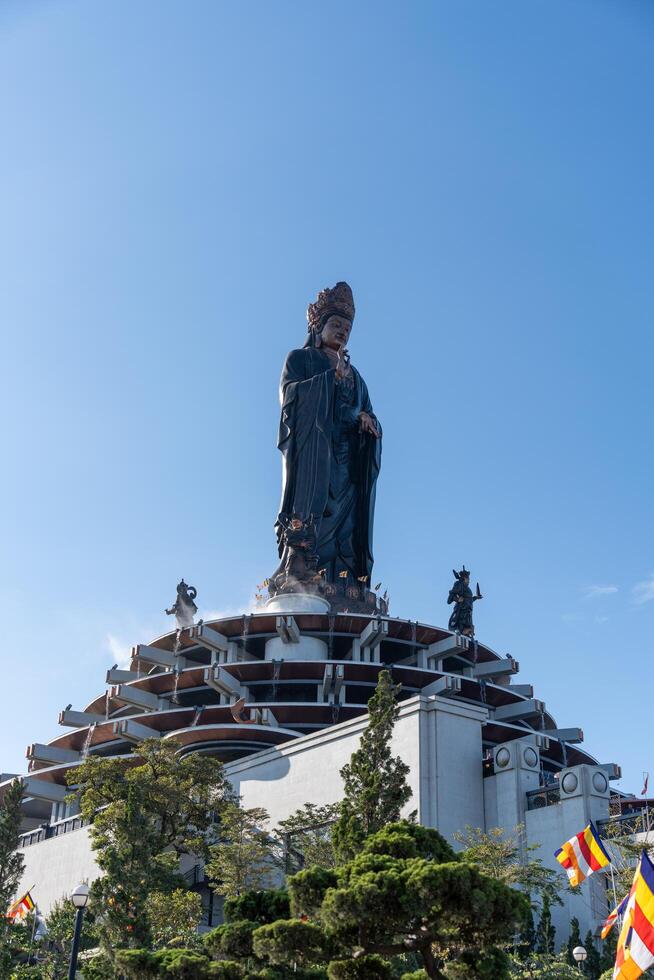 View of Ba Den mountain tourist area, Tay Ninh province, Vietnam. A unique Buddhist architecture with the highest elevation in the area view from below is very beautiful. photo