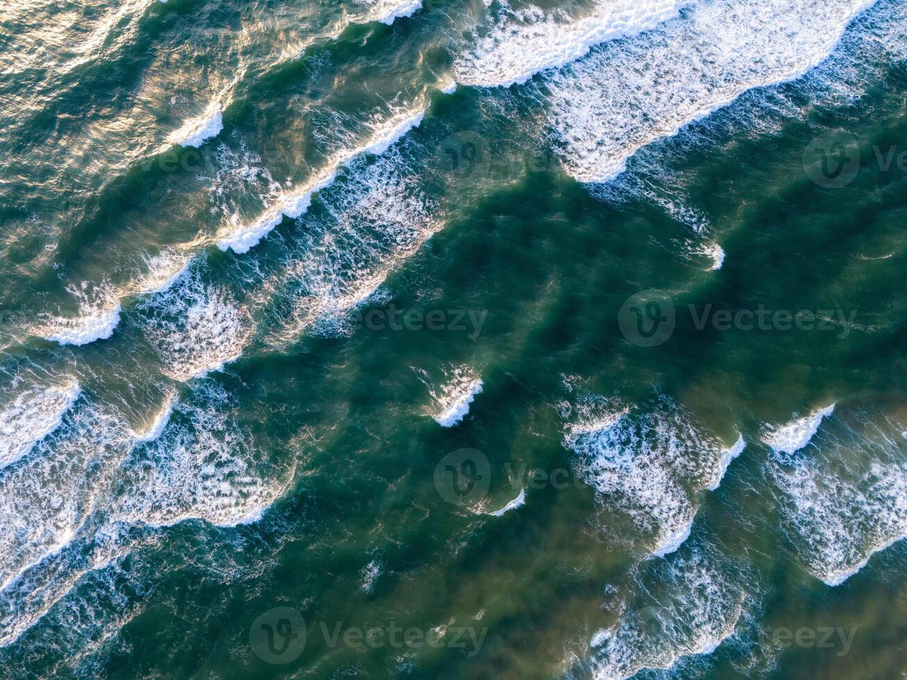 Ocean waves on the beach as a background. Aerial top down view of beach and sea with blue water waves. Vietnam beach photo