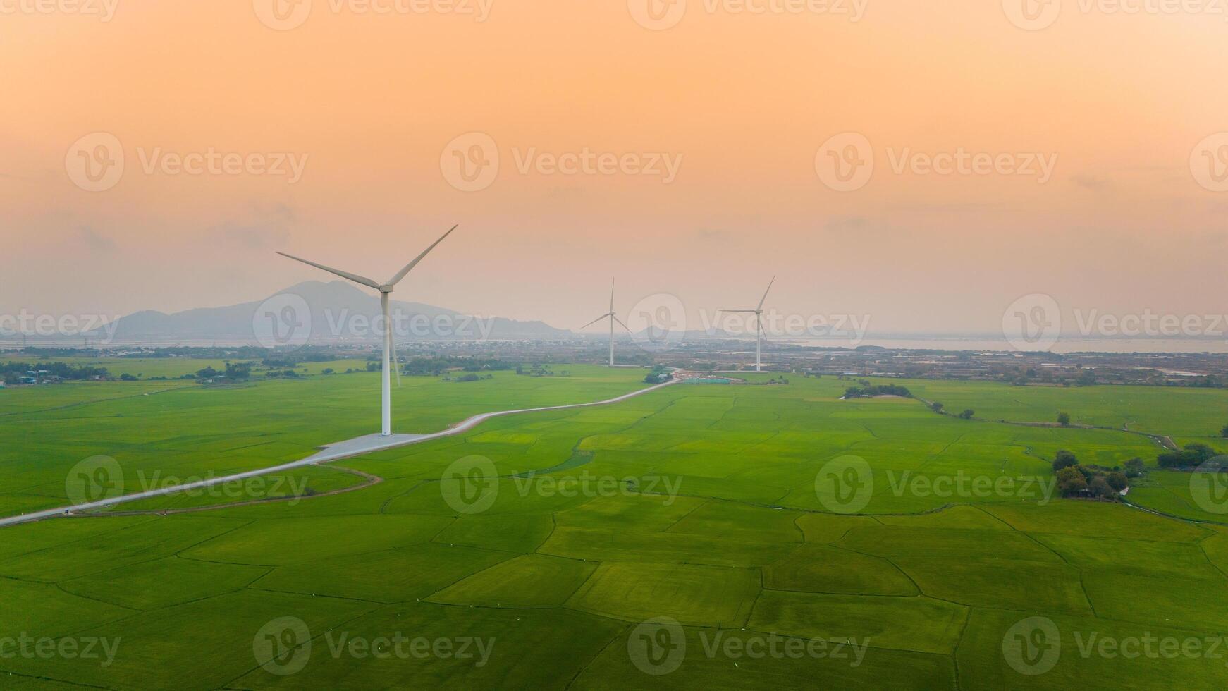 view of turbine green energy electricity, windmill for electric power production, Wind turbines generating electricity on rice field at Phan Rang, Ninh Thuan province, Vietnam photo