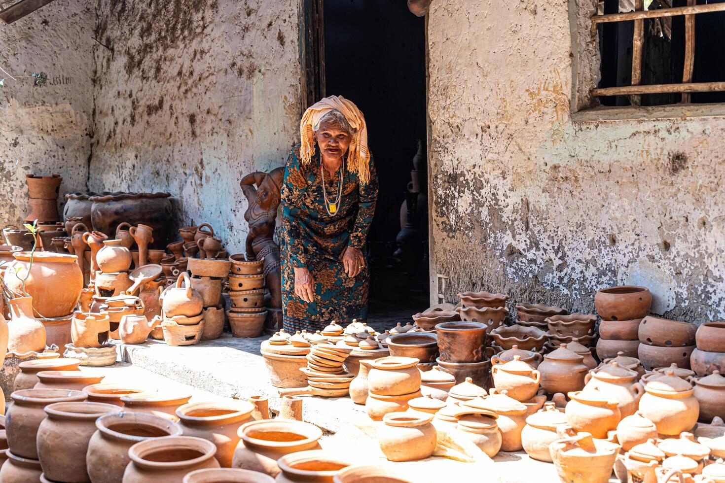 old female of Cham ethnic girl in Bau Truc pottery village, Phan Rang city, Ninh Thuan province, Vietnam. People and travel concept. photo