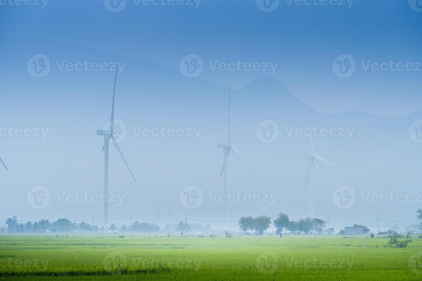 view of turbine green energy electricity, windmill for electric power production, Wind turbines generating electricity on rice field at Phan Rang, Ninh Thuan province, Vietnam photo