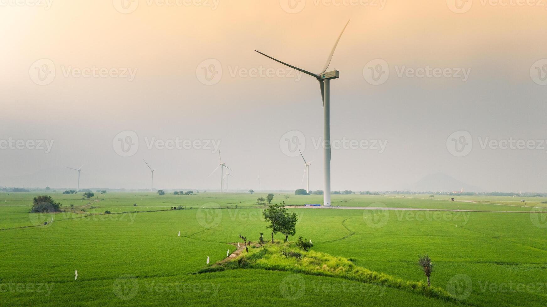 view of turbine green energy electricity, windmill for electric power production, Wind turbines generating electricity on rice field at Phan Rang, Ninh Thuan province, Vietnam photo
