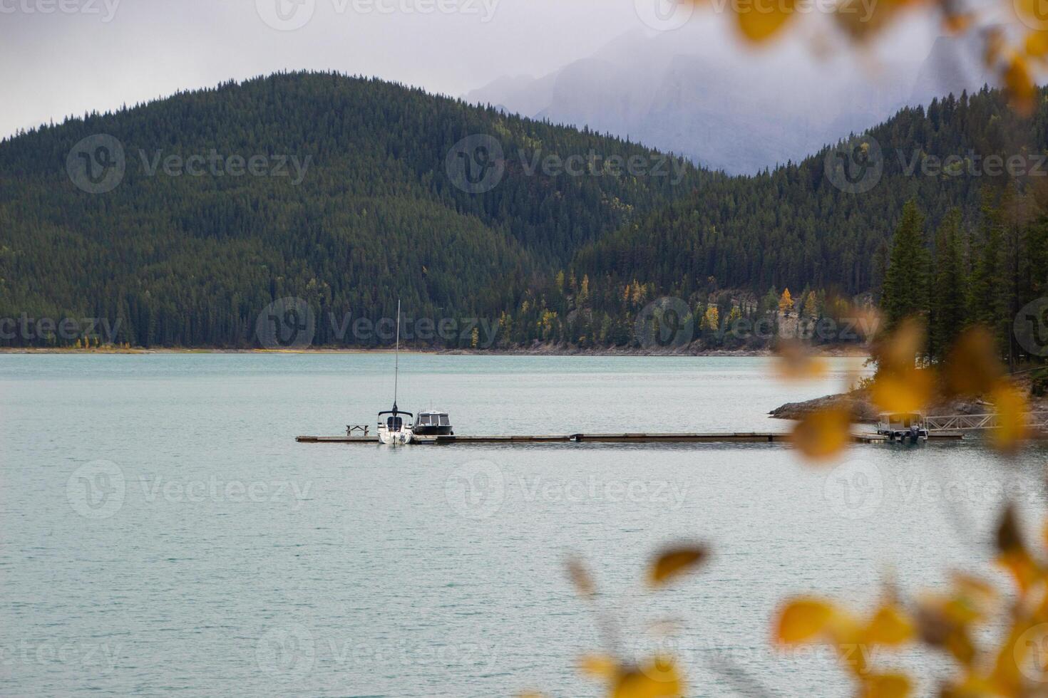 Boat on the lake Minnewanka photo