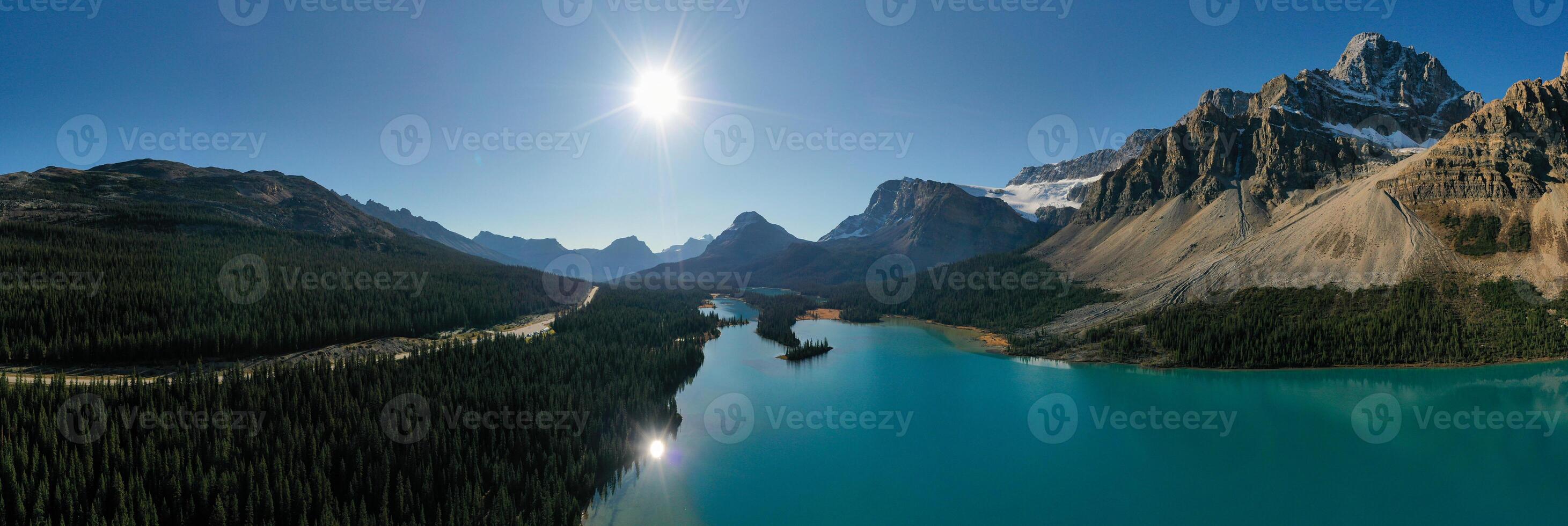 Incredible Panoramic aerial view of Bow Lake with the reflection of the mountains. photo
