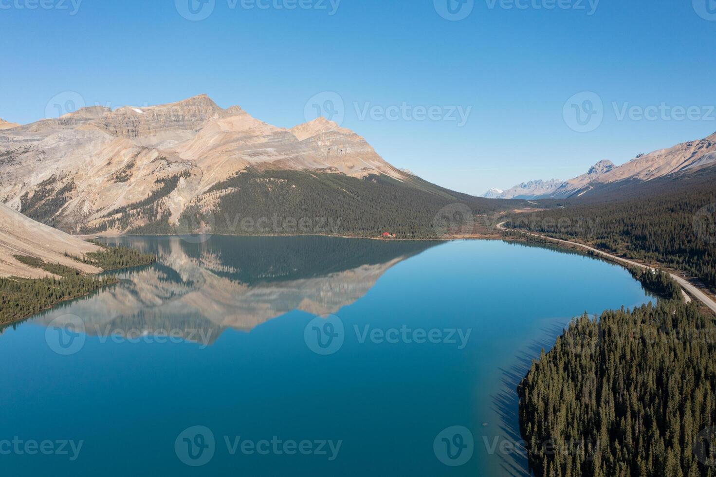 Aerial view of Bow Lake and the reflection of Mount Jimmy Simpson photo