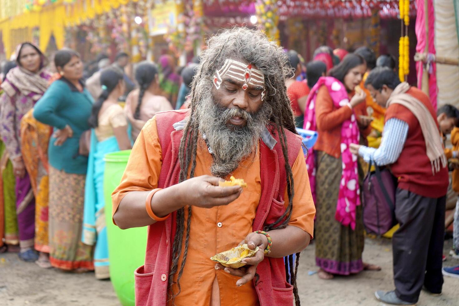 15th January 2023, Kolkata, West Bengal, India. Landscape of Indian Sadhu taking breakfast at Kolkata Gangasagar Transit Camp photo