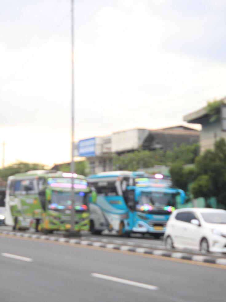defocused abstract background of bus on the highway at semarang, Indonesia April 16 2024 photo