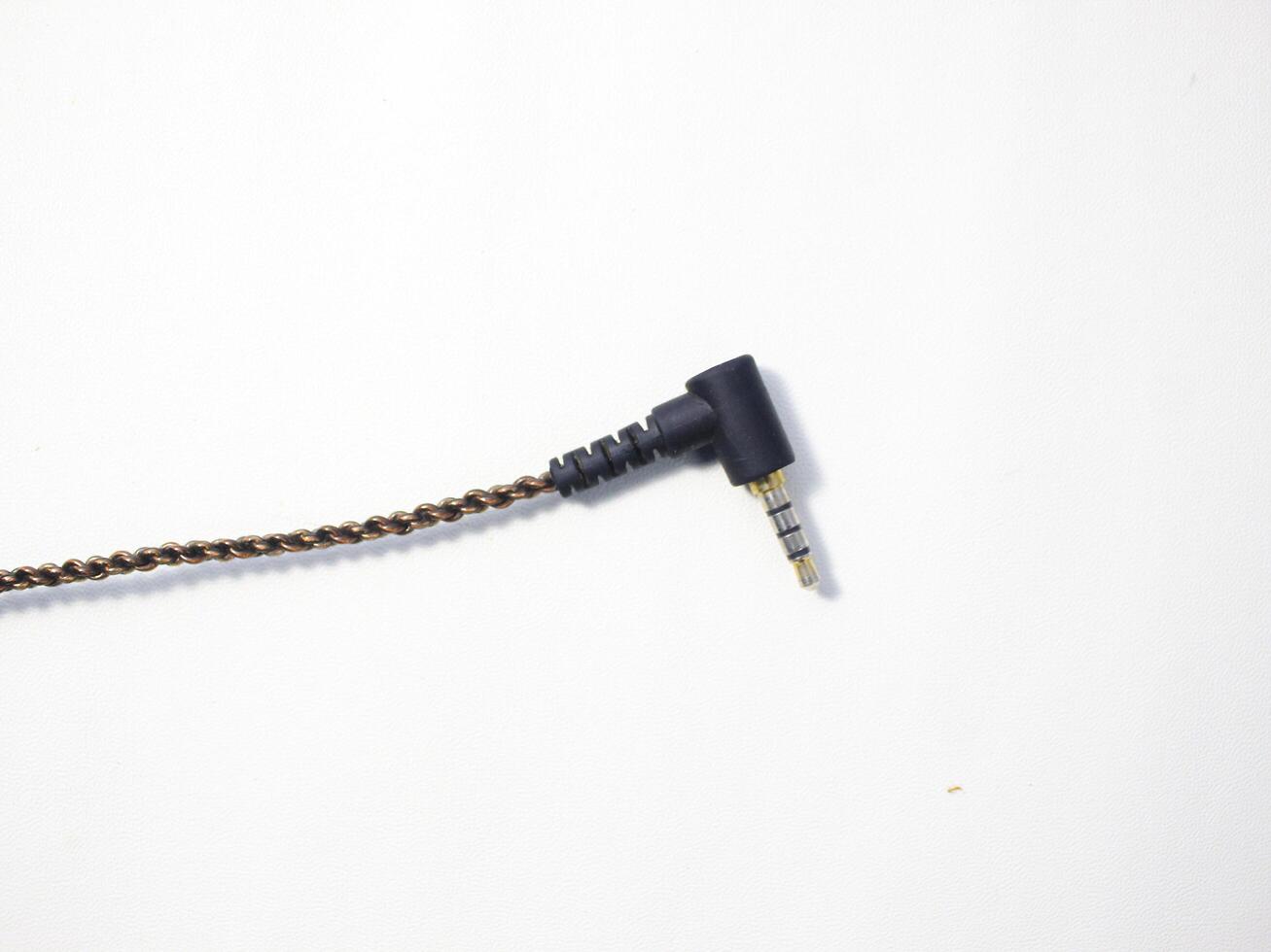 Black power cable with plug isolated on white background photo