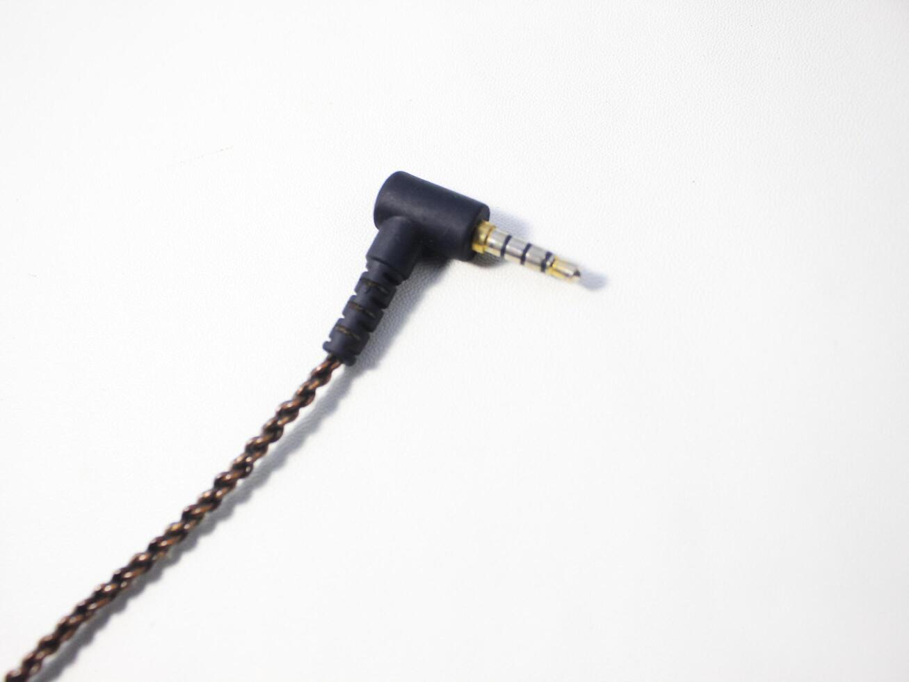 Black power cable with plug isolated on white background photo