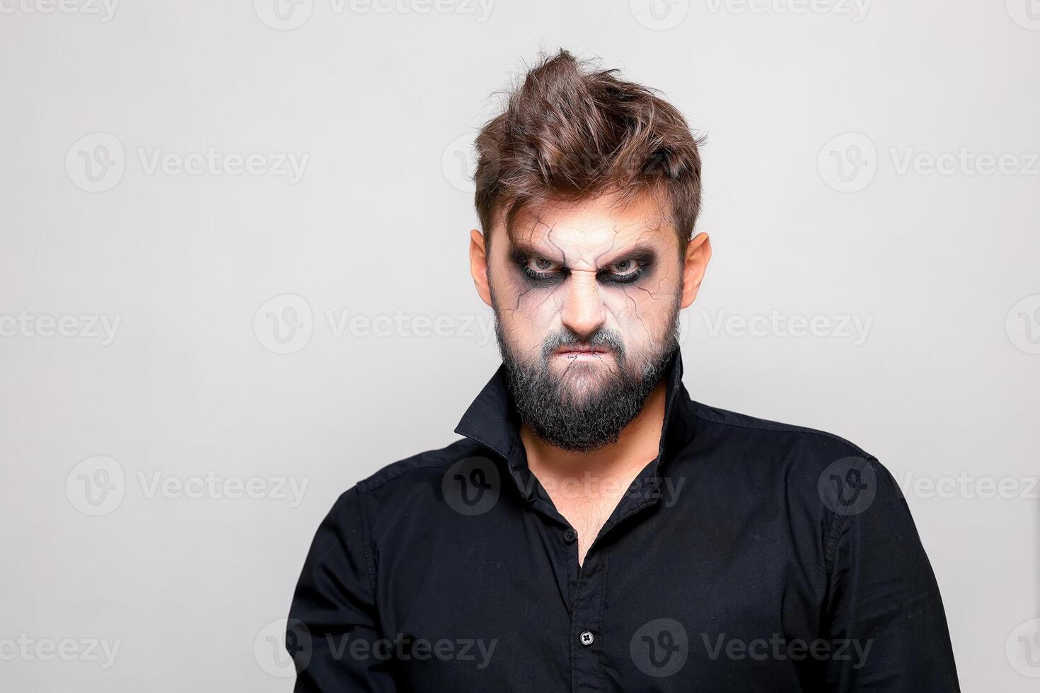 bearded men with makeup for Halloween looks at the camera photo