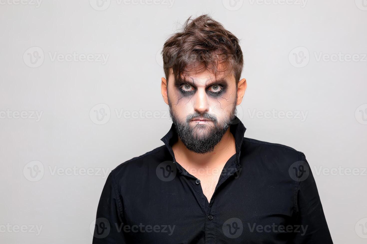 bearded men with makeup for Halloween looks at the camera photo