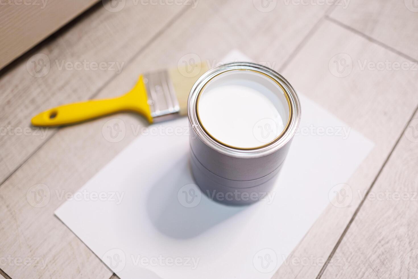 Closeup of a can of white paint for painting. Repair staining the doors with paint. 44784075