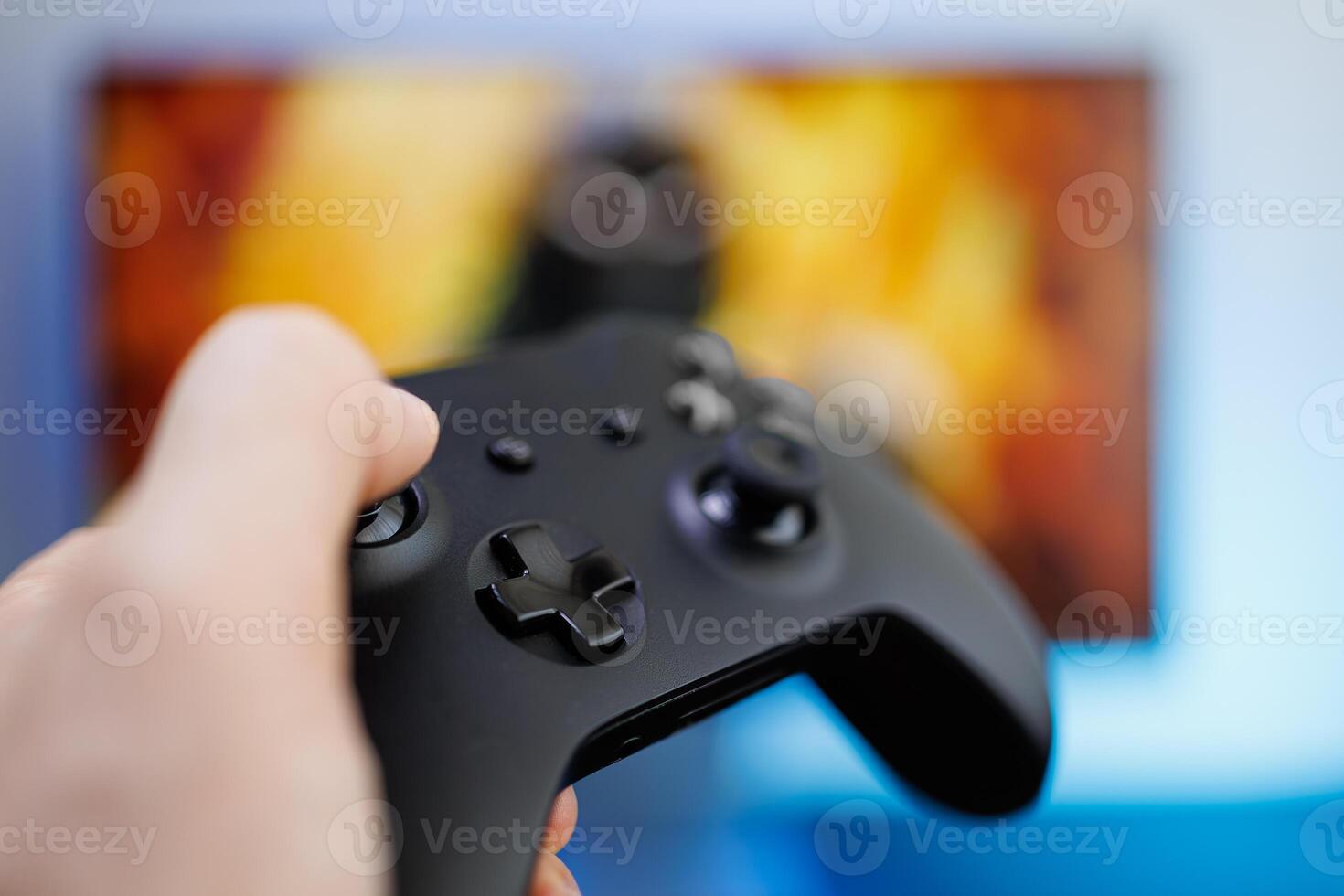 A close-up of the game controller's control buttons. game gamepad in hand photo