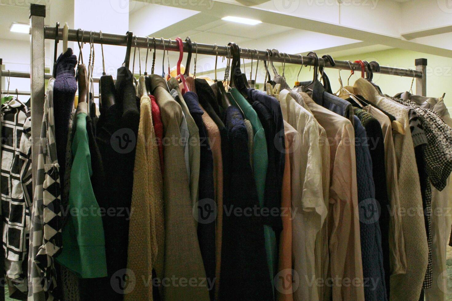 Vintage clothing shop. Second hand flea market. Circular fashion, donation, charity. Thrifting store. Eco friendly sustainable shopping, zero waste concept. photo