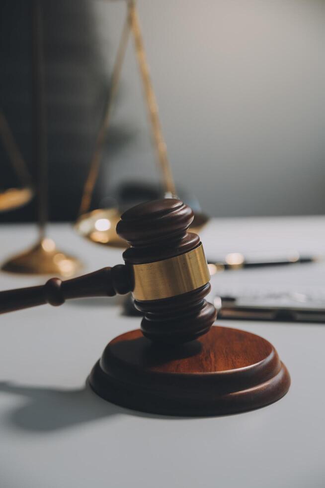 Lawyer, legal advisor, businessman brainstorming information on agreement details Business contracts in legal processing books for accuracy in contract documents. joint financial investment. photo