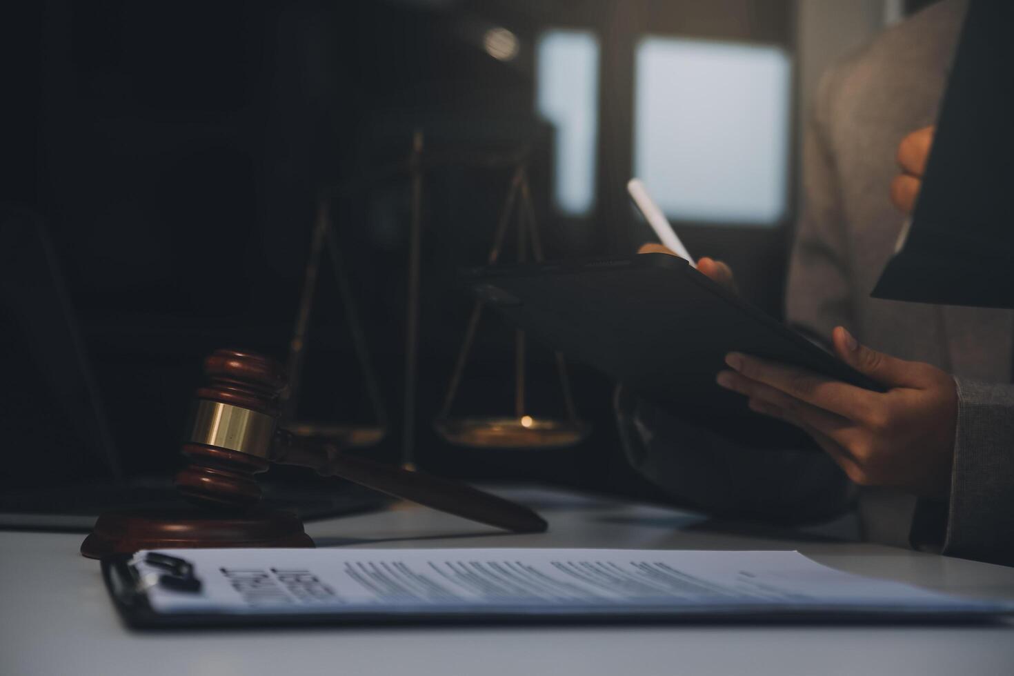 Lawyer, legal advisor, businessman brainstorming information on agreement details Business contracts in legal processing books for accuracy in contract documents. joint financial investment. photo