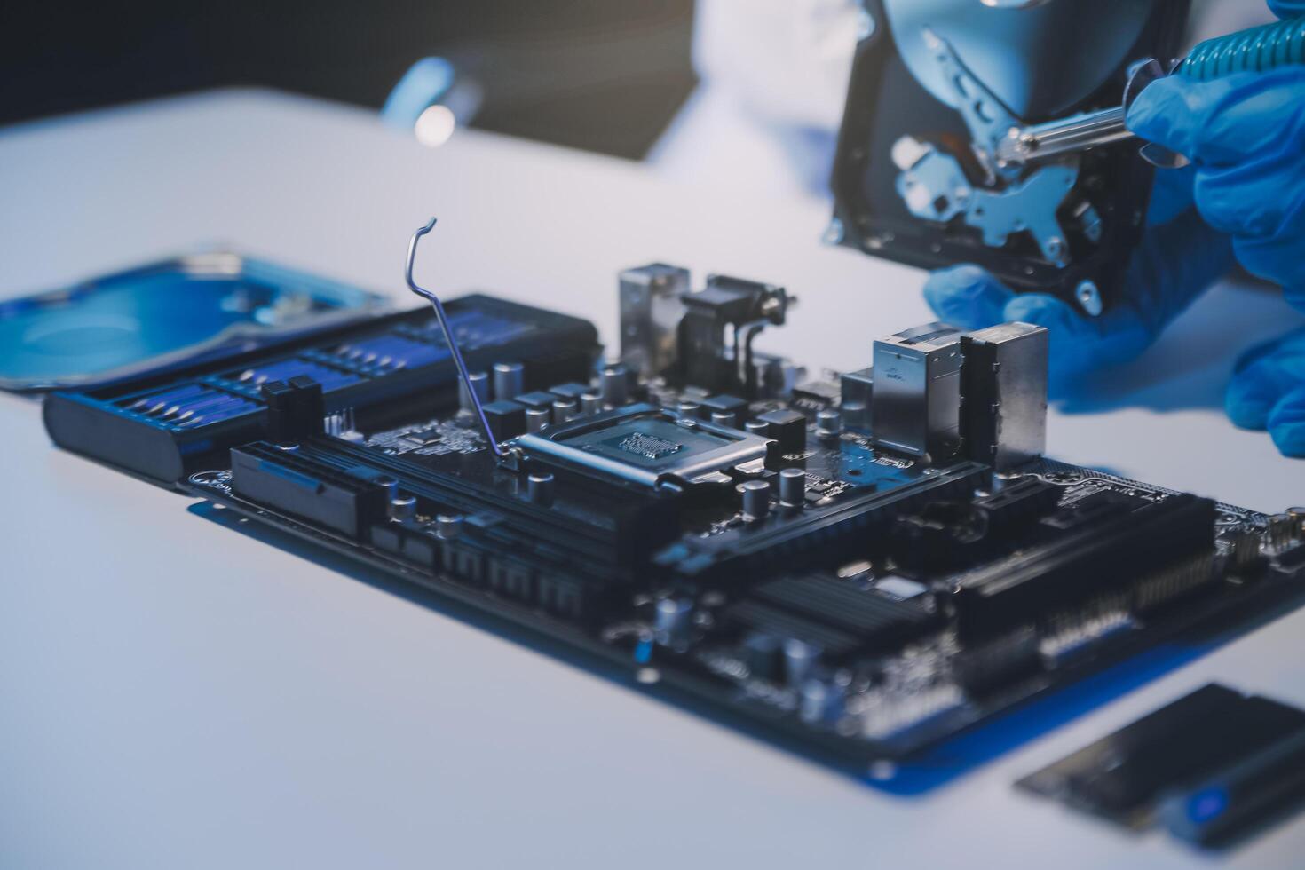 Close up of Technician measuring voltage electronic circuit board television, Service after sale fix electric equipment within insurance. photo