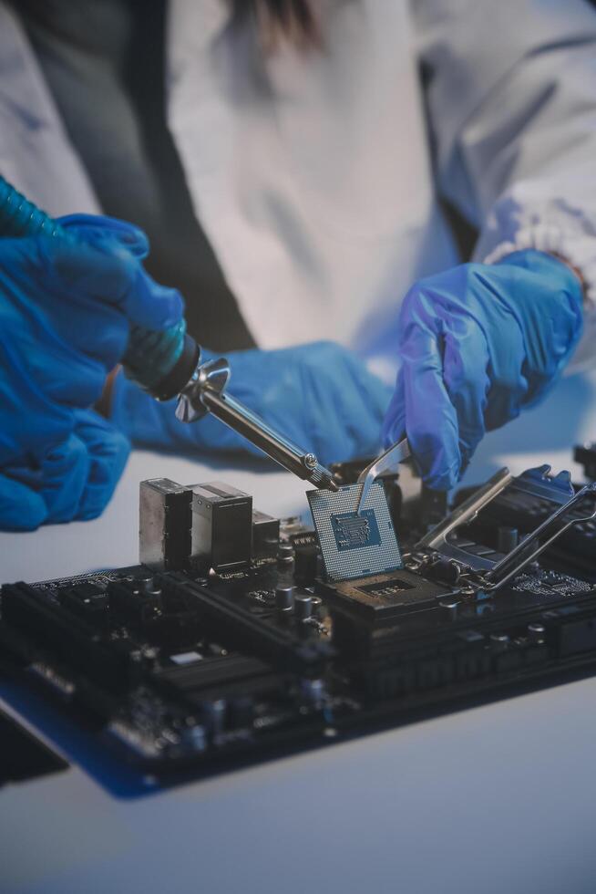 Close up of Technician measuring voltage electronic circuit board television, Service after sale fix electric equipment within insurance. photo