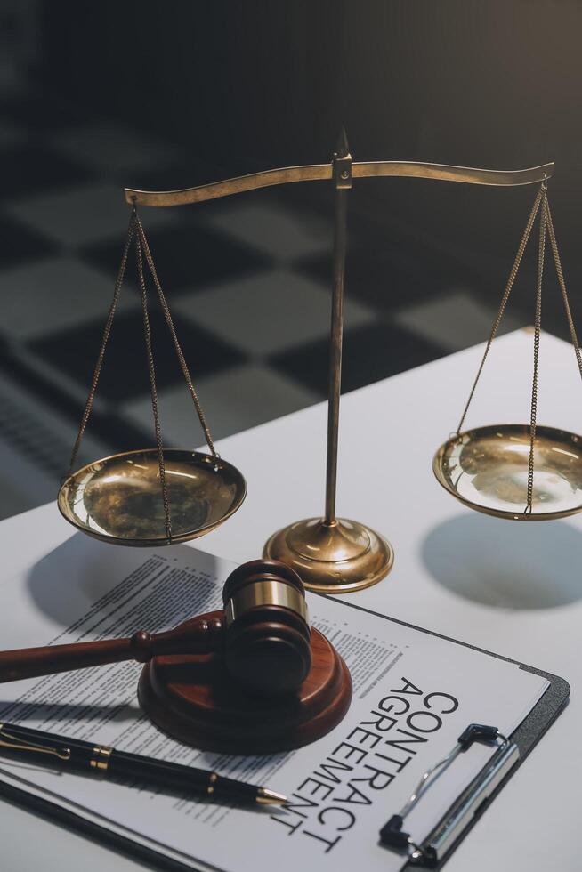 Lawyer, legal advisor, businessman brainstorming information on agreement details Business contracts in legal processing books for accuracy in contract documents. joint financial investment. photo