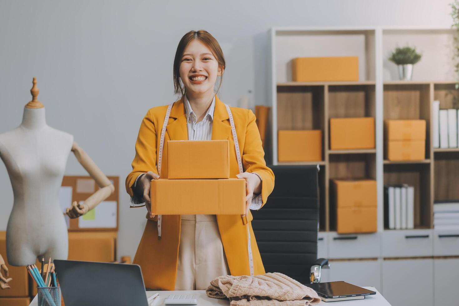 Portrait of Starting small businesses owners female entrepreneurs working on receipt box and check online orders to prepare to pack the boxes, sell to customers, sme business ideas online. photo