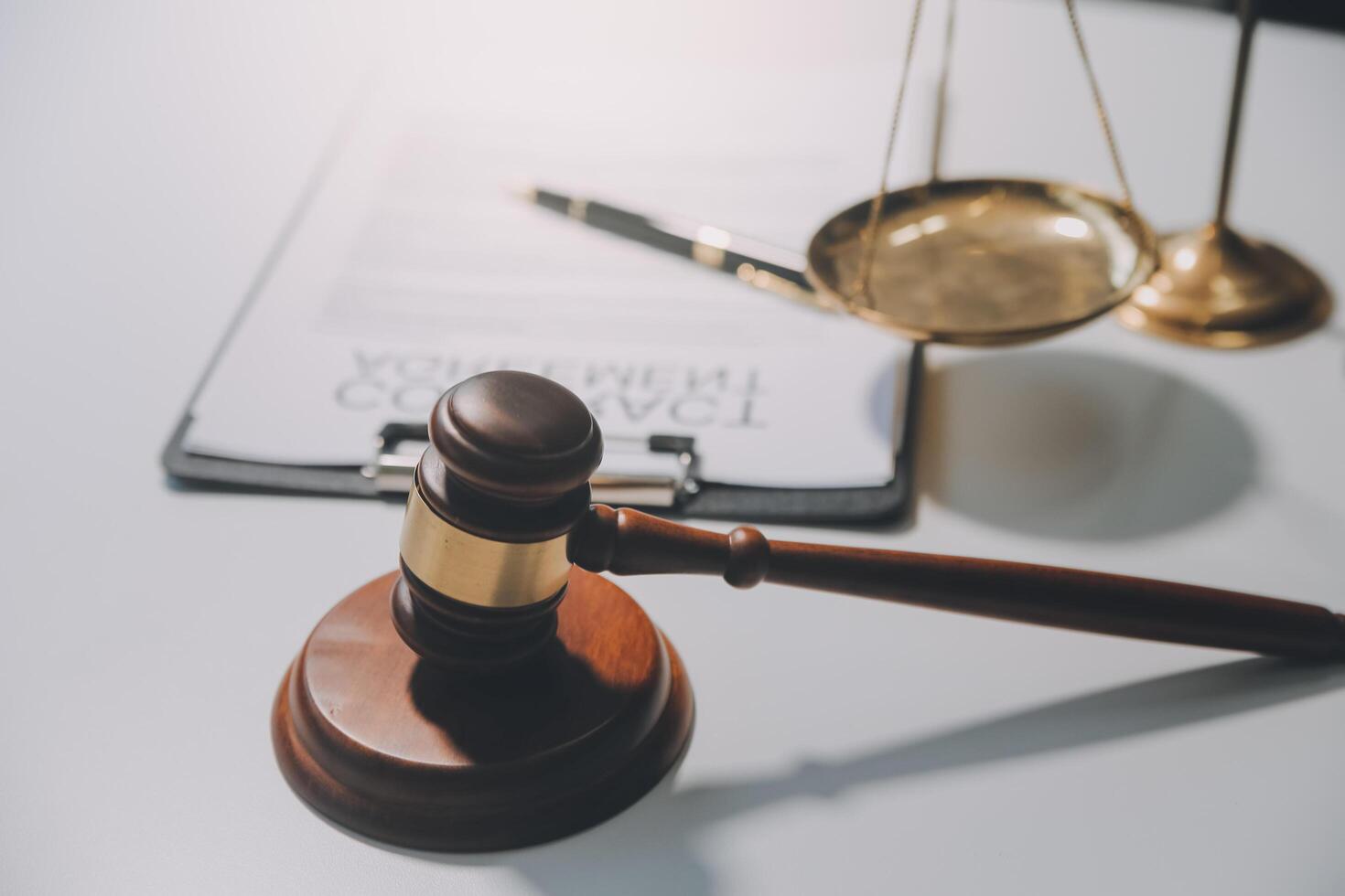 Lawyer, legal advisor, businessman brainstorming information on agreement details Business contracts in legal processing books for accuracy in contract documents. joint financial investment. photo