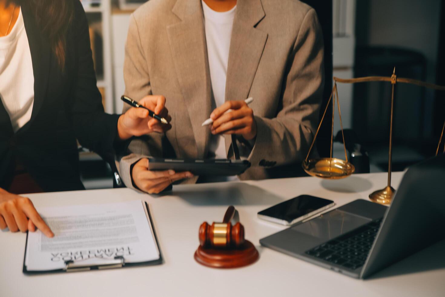 Lawyer, legal advisor, businessman brainstorming information on agreement details Business contracts in legal processing books for accuracy in contract documents. joint financial investment. photo