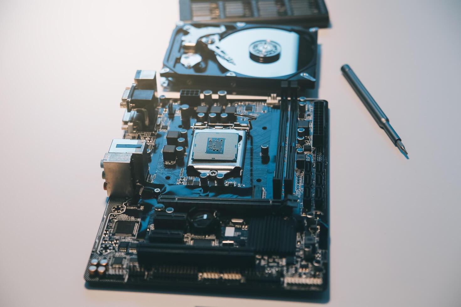 Close up of Technician measuring voltage electronic circuit board television, Service after sale fix electric equipment within insurance. photo