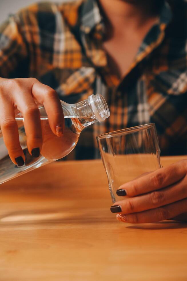 healthy beautiful young woman holding glass of water photo