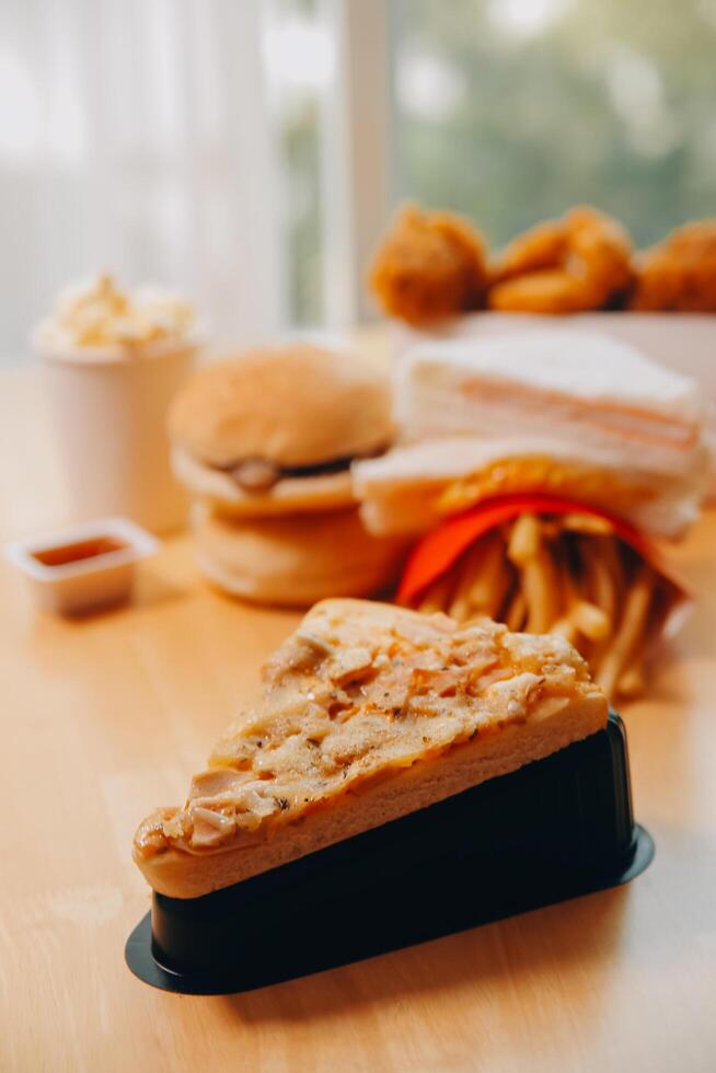 Multiple type of Fast food on table. photo