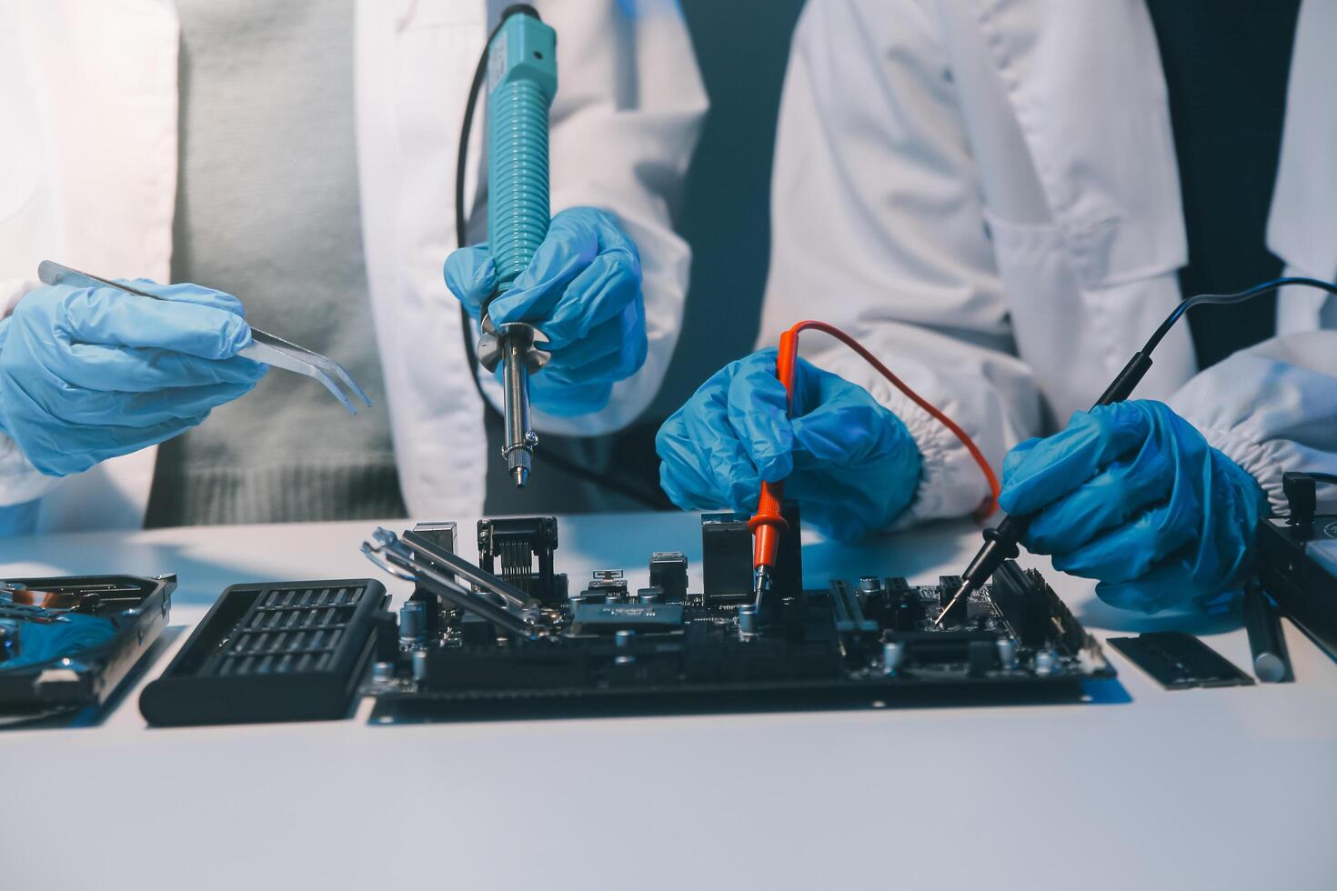 Close up of Technician measuring voltage electronic circuit board television, Service after sale fix electric equipment within insurance. photo