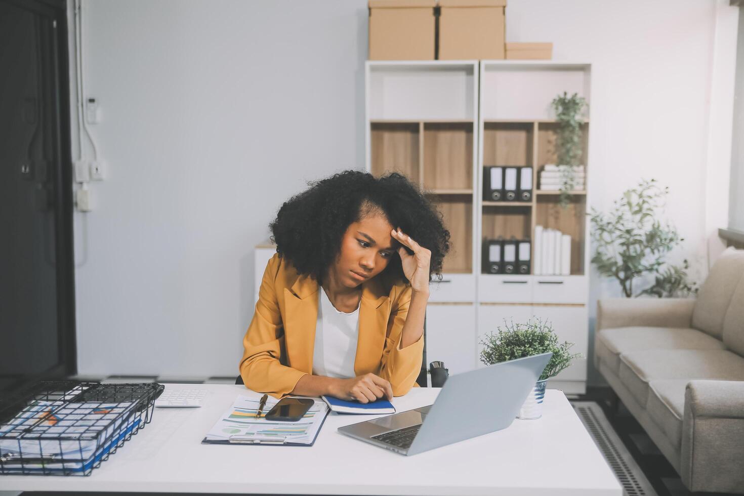 Business women are stressed while working on laptop, Tired asian businesswoman with headache at office, feeling sick at work, copy space photo
