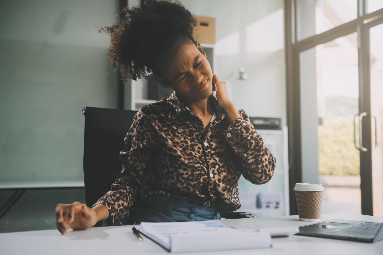 Asian women Aches from working She felt like relaxing photo