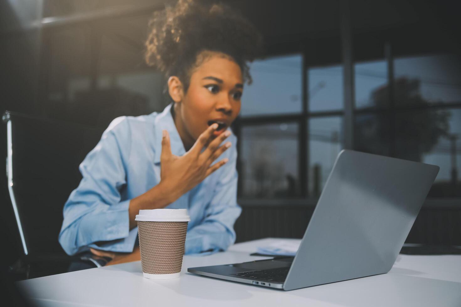 business woman sitting at work stressed , out working hard Feeling stressed out and dizzy from your job photo