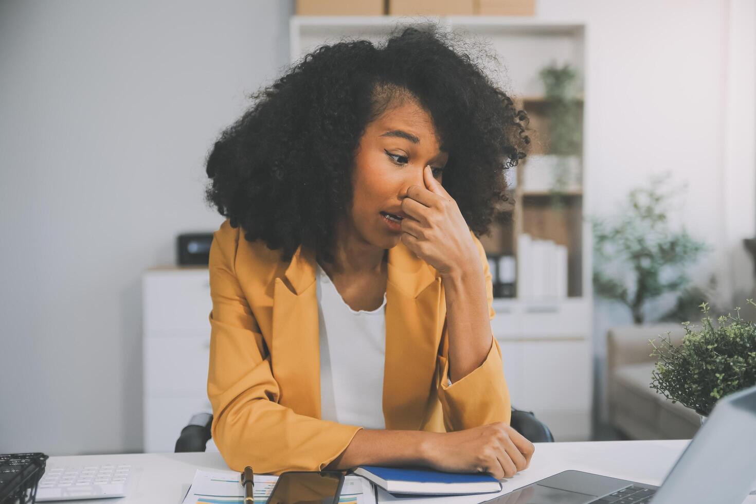 Business women are stressed while working on laptop, Tired asian businesswoman with headache at office, feeling sick at work, copy space photo