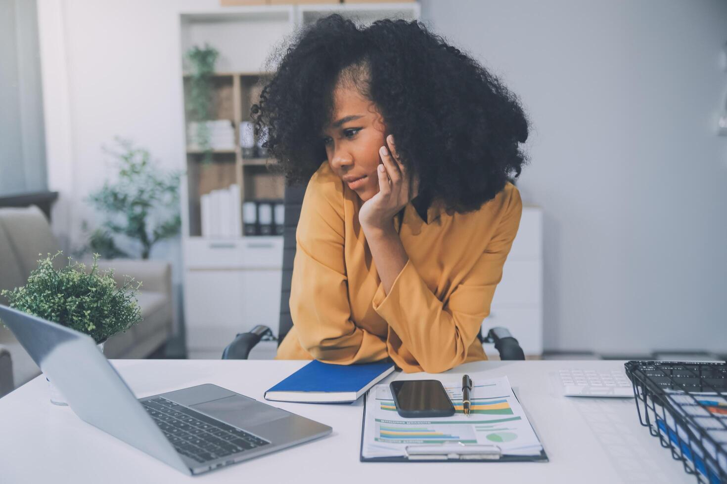 Business women are stressed while working on laptop, Tired asian businesswoman with headache at office, feeling sick at work, copy space photo