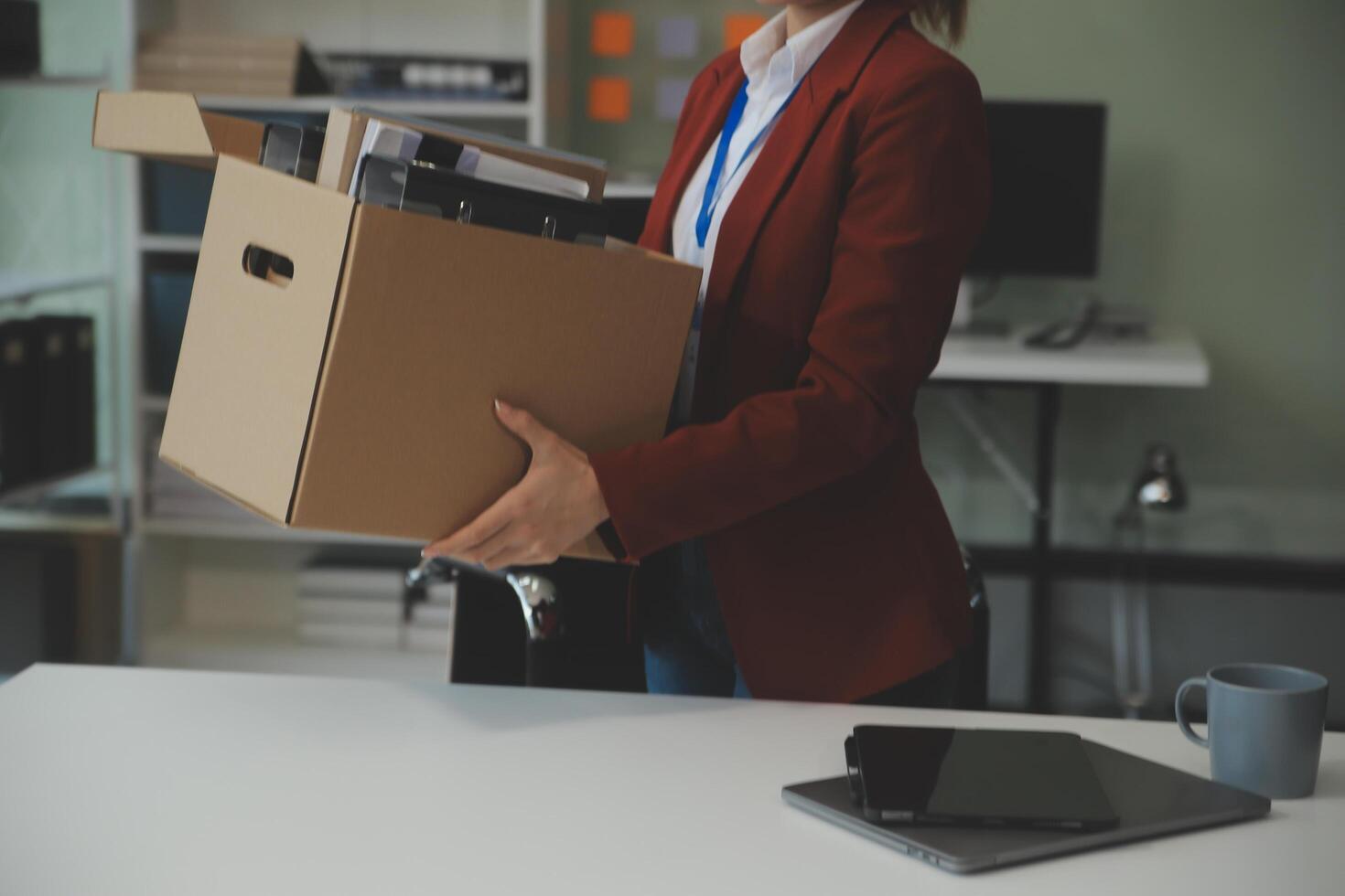 Businesswoman packing her things for move photo
