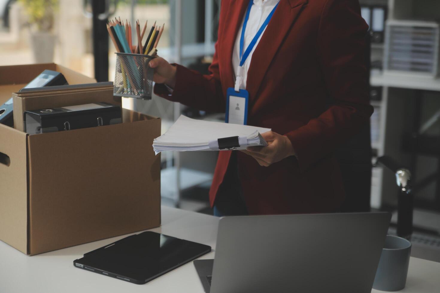 Businesswoman packing her things for move photo
