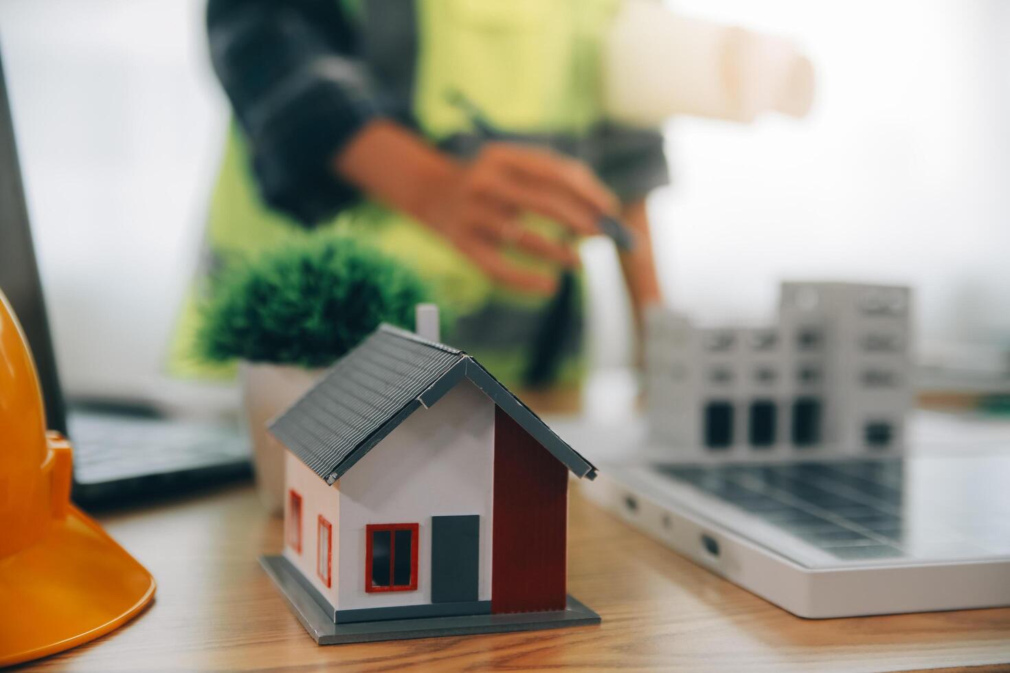 Wind energy engineer designing and developing project for residential district photo